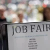 Signage for a job fair is seen on 5th Avenue after the release of the jobs report in Manhattan, New York City, U.S., September 3, 2021. REUTERS/Andrew Kelly/File Photo