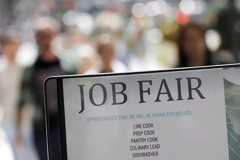 Signage for a job fair is seen on 5th Avenue after the release of the jobs report in Manhattan, New York City, U.S., September 3, 2021. REUTERS/Andrew Kelly/File Photo