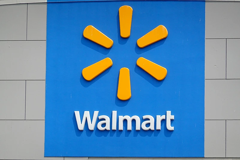 The company logo is shown on the front of the building at a Walmart store on May 18, 2023 in Chicago, Illinois. Walmart, the world's largest retailer, today reported first-quarter same-store sales growth that beat expectations and the company raised its full-year forecast. (Photo by Scott Olson/Getty Images)