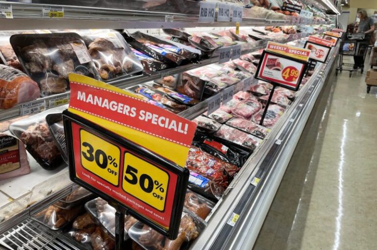 A sign announces a sale for meat at a Safeway grocery store in Annapolis, Maryland, on May 16, 2022, as Americans brace for summer sticker shock as inflation continues to grow. (Photo by Jim WATSON / AFP) (Photo by JIM WATSON/AFP via Getty Images)