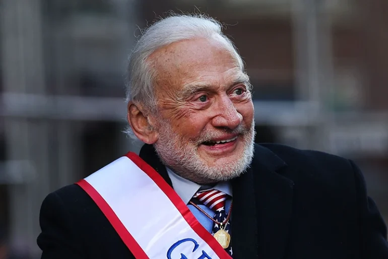 Grand Marshal space pioneer Buzz Aldrin drives up Fifth Avenue in a convertible during the Veterans Day Parade on November 11, 2017 in New York City. The largest Veterans Day event in the nation, this year's parade features thousands of marchers, including military units, civic and youth groups, businesses and high school bands from across the country and veterans of all eras. The U.S. Air Force is this year's featured service. (Photo by Spencer Platt/Getty Images)