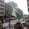 Lagos, NIGERIA: A Nigerian flag flies at half mast at a Lagos public building 24 October 2005. The Nigerian government has declared a three-day national mourning in honour of 117 passengers who died in a Bellview air crash at Lissa village in Ifo district southwest Nigeria. (Photo credit should read PIUS UTOMI EKPEI/AFP via Getty Images)