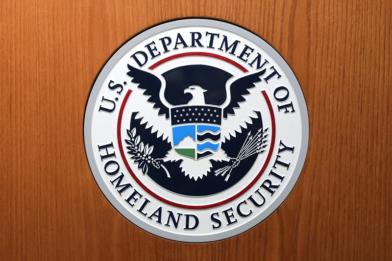 WASHINGTON, DC - AUGUST 21: The Department of Homeland Security seal on the podium used by acting Secretary Kevin McAleenan as he announces new rules about how migrant children and families are treated in federal custody at the Ronald Reagan Building August 21, 2019 in Washington, DC. The Trump Administration announced the change in rules that would allow it to indefinitely detain migrant families who cross the border illegally, replacing the Flores Agreement which limited on how long the government could hold migrant children in custody and how they must be cared for. (Photo by Chip Somodevilla/Getty Images)