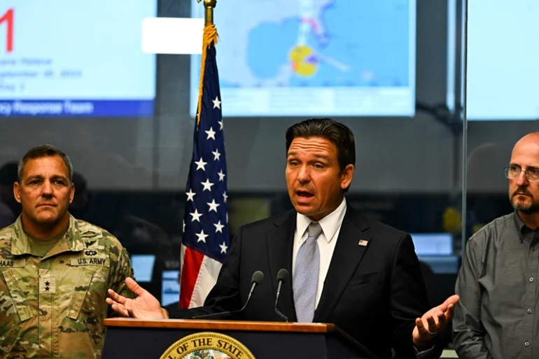 Florida Governor Ron DeSantis speaks during a press conference at the State Emergency Operations Center in Tallahassee, Florida, on September 26, 2024 as Hurricane Helene was set to slam into the Florida coast as a "catastrophic" Category 4 storm. An increasingly powerful hurricane threatening "catastrophic," dangerous storm surges and flooding was forecast to hit Florida's Gulf coast on September 26, as thousands of residents evacuated towns along the US state's shoreline. Helene strengthened into a hurricane mid-morning September 25 in the Gulf of Mexico and is "expected to bring life-threatening storm surge, damaging winds, and flooding rains to a large portion of Florida and the Southeastern United States," the National Hurricane Center in Miami said in its latest bulletin. (Photo by CHANDAN KHANNA / AFP) (Photo by CHANDAN KHANNA/AFP via Getty Images)