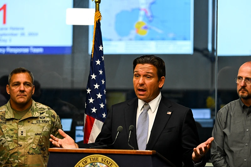 Florida Governor Ron DeSantis speaks during a press conference at the State Emergency Operations Center in Tallahassee, Florida, on September 26, 2024 as Hurricane Helene was set to slam into the Florida coast as a "catastrophic" Category 4 storm. An increasingly powerful hurricane threatening "catastrophic," dangerous storm surges and flooding was forecast to hit Florida's Gulf coast on September 26, as thousands of residents evacuated towns along the US state's shoreline. Helene strengthened into a hurricane mid-morning September 25 in the Gulf of Mexico and is "expected to bring life-threatening storm surge, damaging winds, and flooding rains to a large portion of Florida and the Southeastern United States," the National Hurricane Center in Miami said in its latest bulletin. (Photo by CHANDAN KHANNA / AFP) (Photo by CHANDAN KHANNA/AFP via Getty Images)