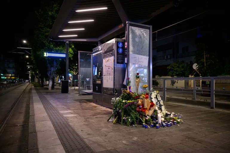 TEL AVIV, ISRAEL - OCTOBER 02: Floral tributes and candles for those killed in a gun and knife attack the previous day are seen on October 02, 2024 in Tel Aviv, Israel. Seven people were killed and several more injured in a shooting and knife attack on Tuesday, at a light rail stop in the Jaffa area of Tel Aviv, Israel. Israeli police say the attackers were "neutralized" at the scene. The Hamas militant group has since claimed responsibility for the attack. (Photo by Leon Neal/Getty Images)