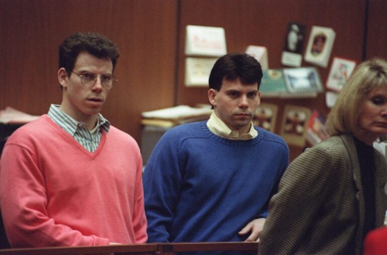 Erik Menendez (L) and his brother Lyle (R) listen during a pre-trial hearing, on December 29, 1992 in Los Angeles after the two pleaded innocent in the August 1989 shotgun deaths of their wealthy parents, Jose and Mary Louise Menendez of Beverly Hills, Calif. It took 40 months for the Superior Court arraignment after prosecutors and defense attorneys battled over the admissibility of taped confessions the brothers allegedly made to their psychotherapist. AFP PHOTO VINCE BUCCI (Photo by VINCE BUCCI / AFP) (Photo by VINCE BUCCI/AFP via Getty Images)