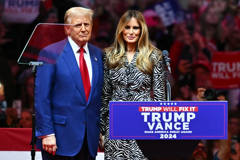 Former US President and Republican presidential candidate Donald Trump joins former First Lady Melania Trump on stage during a campaign at Madison Square Garden in New York, October 27, 2024. (Photo by ANGELA WEISS / AFP) (Photo by ANGELA WEISS/AFP via Getty Images)
