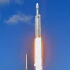 A SpaceX Falcon Heavy rocket with the Europa Clipper spacecraft aboard launches from Launch Complex 39A at NASA's Kennedy Space Center in Cape Canaveral on October 14, 2024. The spacecraft Clipper will soon launch for Jupiter's moon Europa, one of dozens of moons orbiting the Solar System's biggest planet and the nearest spot in our celestial neighborhood that could offer a perch for life. It should reach orbit around Jupiter and Europa in 2031, where it will begin a detailed study of the moon scientists believe is covered in frozen water, which could provide a similar habitat to Earth. (Photo by CHANDAN KHANNA / AFP) (Photo by CHANDAN KHANNA/AFP via Getty Images)