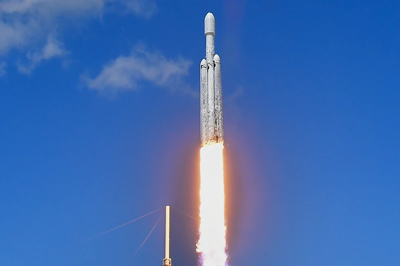 A SpaceX Falcon Heavy rocket with the Europa Clipper spacecraft aboard launches from Launch Complex 39A at NASA's Kennedy Space Center in Cape Canaveral on October 14, 2024. The spacecraft Clipper will soon launch for Jupiter's moon Europa, one of dozens of moons orbiting the Solar System's biggest planet and the nearest spot in our celestial neighborhood that could offer a perch for life. It should reach orbit around Jupiter and Europa in 2031, where it will begin a detailed study of the moon scientists believe is covered in frozen water, which could provide a similar habitat to Earth. (Photo by CHANDAN KHANNA / AFP) (Photo by CHANDAN KHANNA/AFP via Getty Images)