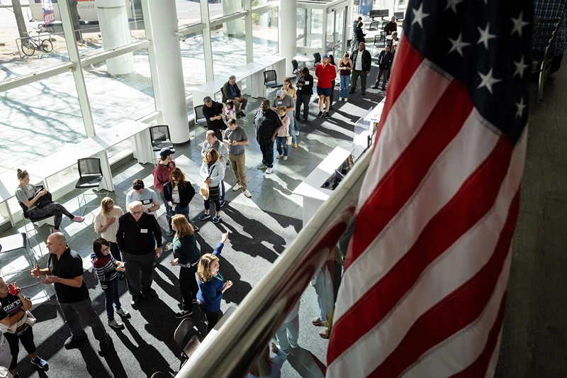 STAMFORD, CONNECTICUT - OCTOBER 21: Voters line up to cast their ballots at the Stamford Government Center on the first day of early voting on October 21, 2024 in Stamford, Connecticut. This is the first time that Connecticut residents can vote early in a presidential election, following a state constitutional amendment approved by voters in 2022. Voters have access to at least one location in each of the state's 169 municipalities until Sunday, November 3. Early voting hours will run most days from 10 a.m. until 6 p.m. (Photo by John Moore/Getty Images)