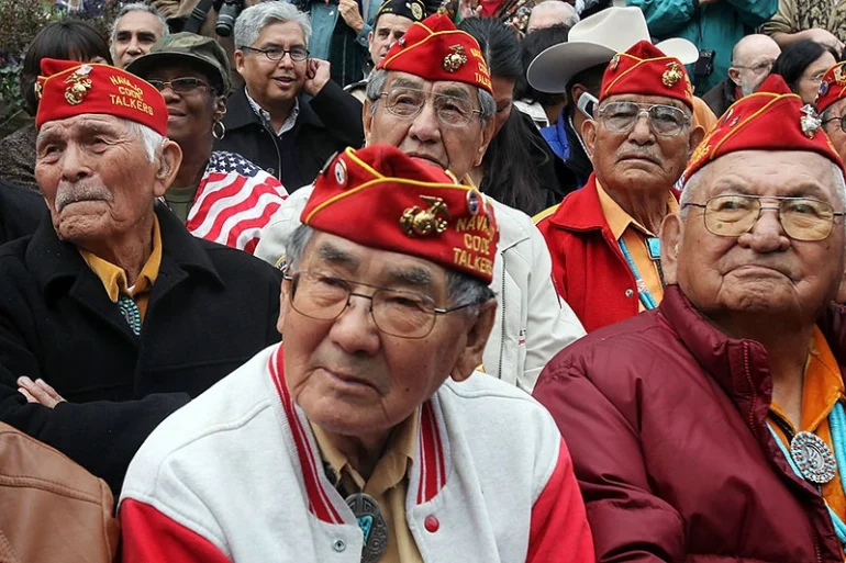 NEW YORK - NOVEMBER 11:  Members of the elite Navajo Code Talkers, the famed U.S. Marine unit who delivered unbreakable codes during World War II battles against the Japanese, look on before the start of the annual Veterans Day parade November 11, 2009 in New York City. Thirteen of the 50 or so remaining Code Talkers participated in today's parade for the first time. The nation's largest Veterans Day parade featuring 20,000 participants in New York is celebrating its 90th anniversary. (Photo by Mario Tama/Getty Images)