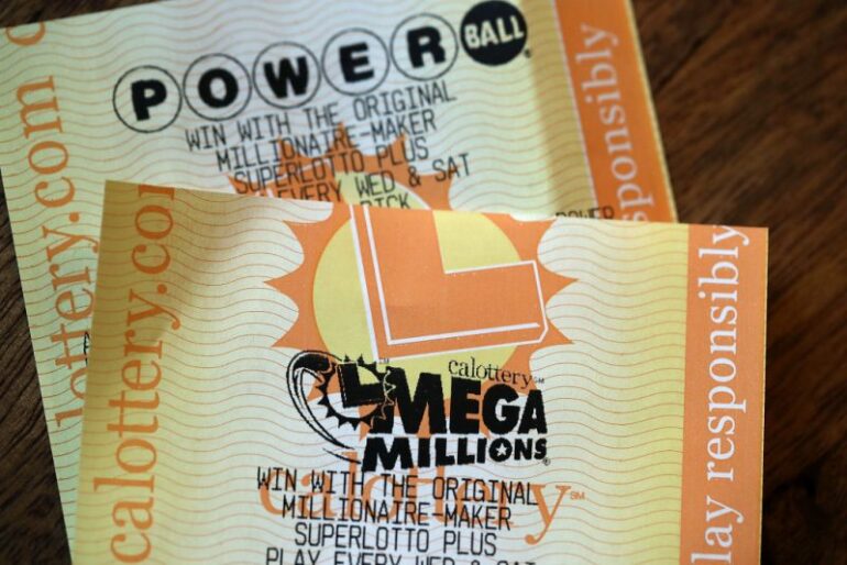 SAN ANSELMO, CA - JANUARY 03: Powerball and Mega Millions lottery tickets are displayed on January 3, 2018 in San Anselmo, California. The Powerball jackpot and Mega Millions jackpots are both over $400 million at the same time for the first time. The Mega Millions $418 million jackpot would be the fourth largest and the $460 million Powerball jackpot would be the seventh largest in the game's history. (Photo by Justin Sullivan/Getty Images)