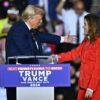 US Shadow Senator from Puerto Rico, Zoraida Buxo Santiago. greets former US President and Republican presidential candidate Donald Trump during a campaign rally at the PPL Center in Allentown, Pennsylvania, on October 29, 2024. (Photo by ANGELA WEISS / AFP) (Photo by ANGELA WEISS/AFP via Getty Images)