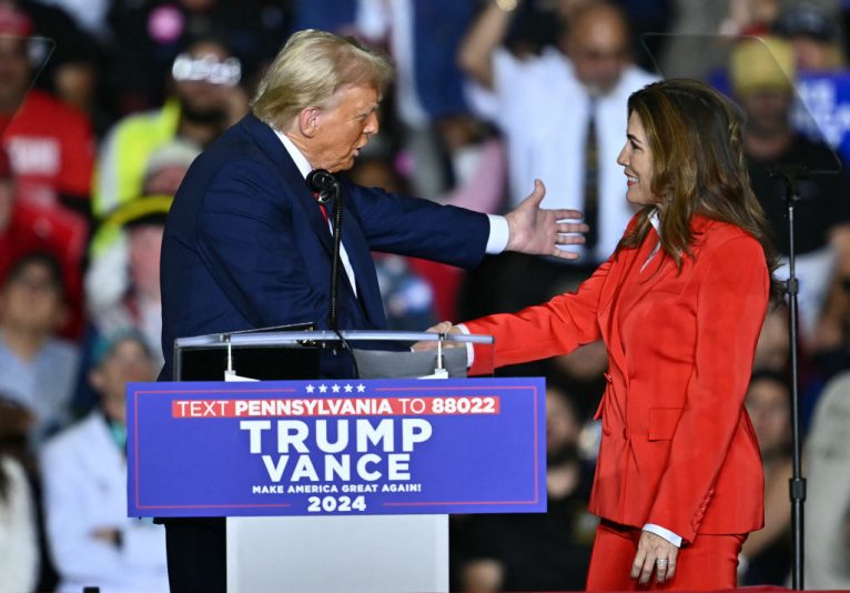 US Shadow Senator from Puerto Rico, Zoraida Buxo Santiago. greets former US President and Republican presidential candidate Donald Trump during a campaign rally at the PPL Center in Allentown, Pennsylvania, on October 29, 2024. (Photo by ANGELA WEISS / AFP) (Photo by ANGELA WEISS/AFP via Getty Images)