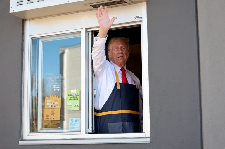 Republican presidential nominee, former U.S. President Donald Trump works the drive-through line as he visits a McDonald's restaurant on October 20, 2024 in Feasterville-Trevose, Pennsylvania. Trump is campaigning the entire day in the state of Pennsylvania. Trump and Democratic presidential nominee Vice President Kamala Harris continue to campaign in battleground swing states ahead of the November 5th election. (Photo by Win McNamee/Getty Images)