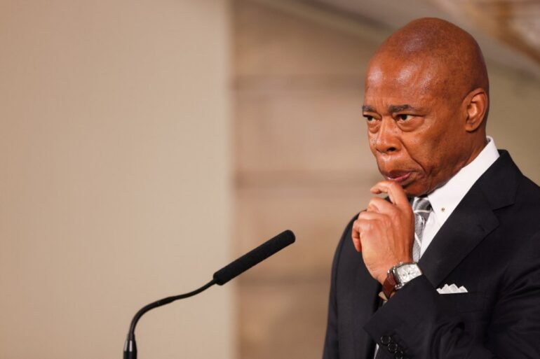 Mayor Eric Adams holding a press conference in City Hall on Oct. 1.