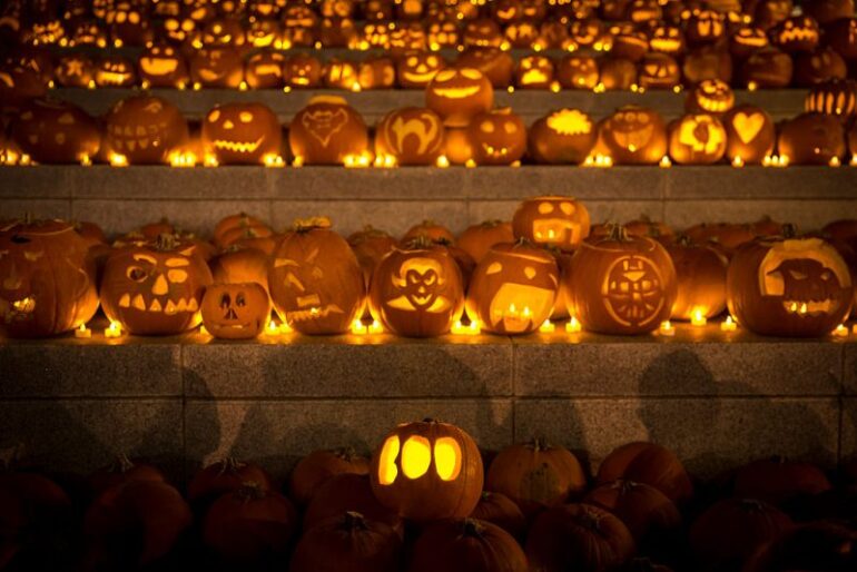 LONDON, ENGLAND - OCTOBER 31: An installation of 3,000 candle-lit pumpkins blanket the canal side steps at Granary Square on October 31, 2014 in London, England. The pumpkins, created by members of youth development group Global Generation and other carvers, will be on display and illuminated from dusk until Saturday November 1, 2014. (Photo by Rob Stothard/Getty Images)