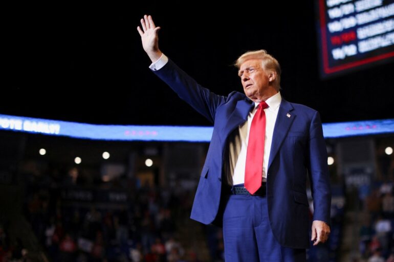 Republican presidential nominee and former U.S. President Donald Trump gestures during a rally in State College, Pennsylvania, U.S. October 26, 2024. REUTERS/Carlos Barria
