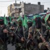 GAZA CITY, GAZA - JULY 20: Palestinian Hamas militants are seen during a military show in the Bani Suheila district on July 20, 2017 in Gaza City, Gaza. For the past ten years Gaza residents have lived with constant power shortages, in recent years these cuts have worsened, with supply of regular power limited to four hours a day. On June 11, 2017 Israel announced a new round of cuts at the request of the Palestinian authorities and the decision was seen as an attempt by President Mahmoud Abbas to pressure Gaza's Hamas leadership. Prior to the new cuts Gaza received 150 megawatts per day, far below it's requirements of 450 megawatts. In April, Gaza's sole power station which supplied 60 megawatts shut down, after running out of fuel, the three lines from Egypt, which provided 27 megawatts are rarely operational, leaving Gaza reliant on the 125 megawatts supplied by Israel's power plant. The new cuts now restrict electricity to three hours a day severely effecting hospital patients with chronic conditions and babies on life support. During blackout hours residents use private generators, solar panels and battery operated light sources to live. June 2017 also marked ten years since Israel began a land, sea and air blockade over Gaza. Under the blockade, movement of people and goods is restricted and exports and imports of raw materials have been banned. The restrictions have virtually cut off access for Gaza's two million residents to the outside world and unemployment rates have skyrocketed forcing many people into poverty and leaving approximately 80% of the population dependent on humanitarian aid. (Photo by Chris McGrath/Getty Images)