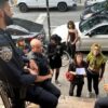 A group of people who were allegedly squatting talk to the police outside of 60 South 4th street In Williamsburg, Brooklyn after being removed from a vacant brownstone.