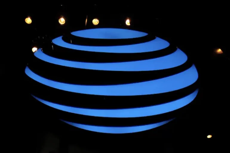 The AT&T logo is seen in a store window, as airports around the country are awaiting for Verizon and AT&T to rollout their 5G technology, in the Manhattan borough of New York City, New York, U.S., January 19, 2022. REUTERS/Brendan McDermid/File Photo