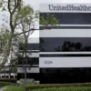 The corporate logo of the UnitedHealth Group appears on the side of one of their office buildings in Santa Ana, California, U.S., April 13, 2020. REUTERS/Mike Blake/File Photo