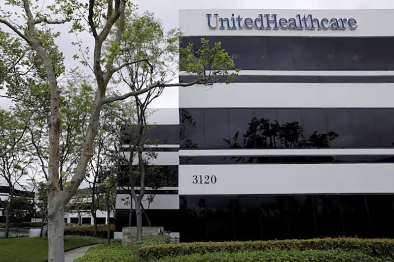 The corporate logo of the UnitedHealth Group appears on the side of one of their office buildings in Santa Ana, California, U.S., April 13, 2020. REUTERS/Mike Blake/File Photo