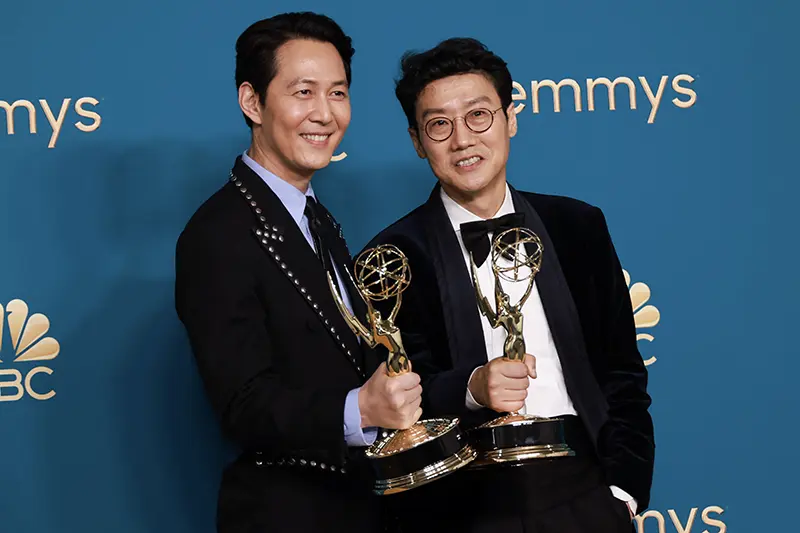 Lee Jung-jae holds his Emmy for Outstanding Lead Actor In A Drama Series for "Squid Game" and Hwang Dong-hyuk, for his Outstanding Directing For A Drama Series for "Squid Game" at the 74th Primetime Emmy Awards held at the Microsoft Theater in Los Angeles, U.S., September 12, 2022. REUTERS/Aude Guerrucci/File Photo