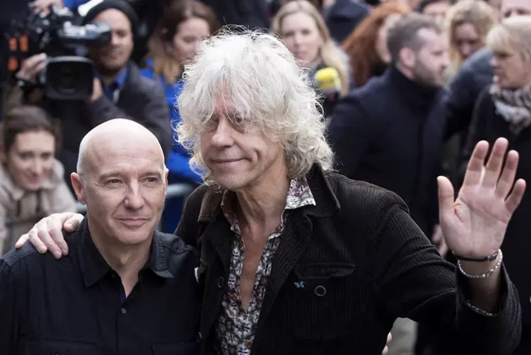 Musician's Midge Ure (L) and Bob Geldof pose as they attend the recording of the Band Aid 30 charity single in west London November 15, 2014. REUTERS/Neil Hall/File Photo