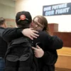 Members of the International Association of Machinists and Aerospace Workers District 751, embrace at a union hall after learning that union members voted to approve a new contract proposal from Boeing in Seattle, Washington, U.S. November 4, 2024. REUTERS/David Ryder Purchase Licensing Rights, opens new tab