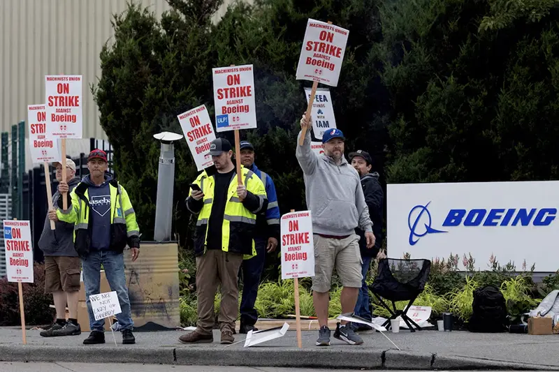 Boeing factory workers gather on a picket line during the first day of a strike near the entrance of a production facility in Renton, Washington, U.S., September 13, 2024. REUTERS/Matt Mills McKnight/File Photo