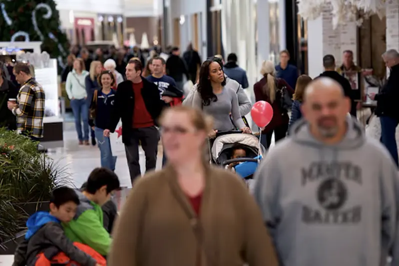 Shoppers walk through the King of Prussia Mall, United States' largest retail shopping space, in King of Prussia, Pennsylvania, U.S., December 8, 2018. REUTERS/Mark Makela/File Photo