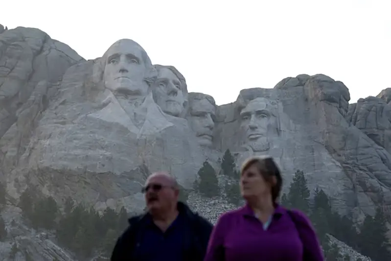 Tourists visit the Mount Rushmore National Memorial, carved with the heads of U.S. presidents George Washington, Thomas Jefferson, Theodore Roosevelt and Abraham Lincoln, in Keystone, South Dakota, U.S. September 6, 2023. REUTERS/Jonathan Ernst/File Photo