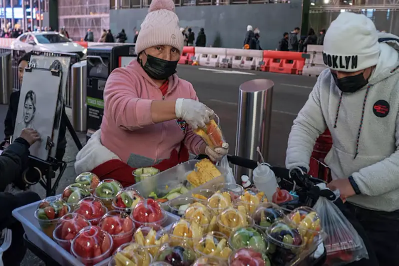 People pack fruits for customers in Manhattan, New York, U.S., December 25, 2023. REUTERS/Eduardo Munoz/File Photo