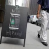 A sign advertising job openings is seen outside of a Starbucks in Manhattan, New York City, New York, U.S., May 26, 2021. REUTERS/Andrew Kelly/File Photo