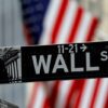 FILE PHOTO: Raindrops hang on a sign for Wall Street outside the New York Stock Exchange in Manhattan in New York City, New York, U.S., October 26, 2020. REUTERS/Mike Segar