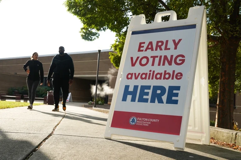 ATLANTA, GEORGIA - OCTOBER 15: Signs direct people where to go to cast their votes on the first day of early voting at Atlanta Metropolitan State College on October 15, 2024 in Atlanta, Georgia. Early voting takes place from October 15 - November 1, ahead of Election Day on November 5. (Photo by Megan Varner/Getty Images)