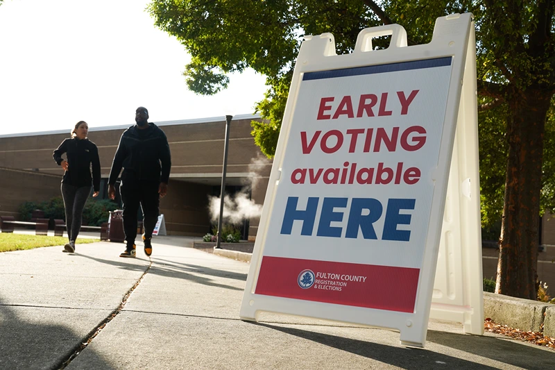 ATLANTA, GEORGIA - OCTOBER 15: Signs direct people where to go to cast their votes on the first day of early voting at Atlanta Metropolitan State College on October 15, 2024 in Atlanta, Georgia. Early voting takes place from October 15 - November 1, ahead of Election Day on November 5. (Photo by Megan Varner/Getty Images)