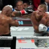 US retired pro-boxer Mike Tyson (L) and US YouTuber/boxer Jake Paul (R) fight during the heavyweight boxing bout at The Pavilion at AT&T Stadium in Arlington, Texas, November 15, 2024. (Photo by TIMOTHY A. CLARY / AFP) (Photo by TIMOTHY A. CLARY/AFP via Getty Images)