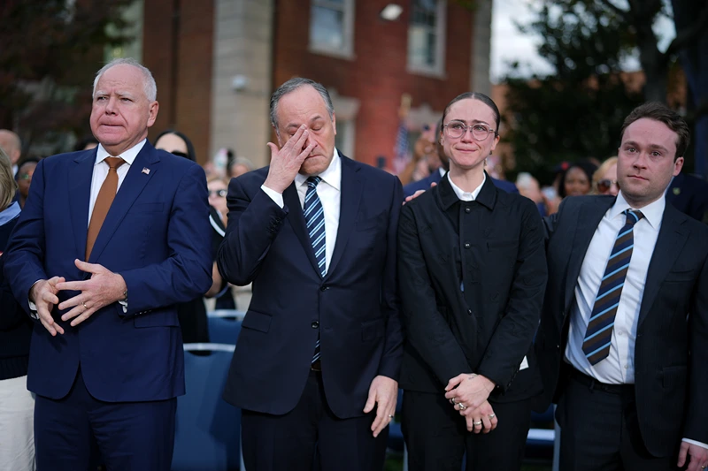 WASHINGTON, DC - NOVEMBER 06: (L-R) Democratic vice presidential nominee, Minnesota Gov. Tim Walz, Second gentleman Doug Emhoff, Ella Emhoff and Cole Emhoff react after Democratic presidential nominee, U.S. Vice President Kamala Harris conceded the election in a speech at Howard University on November 06, 2024 in Washington, DC. After a contentious campaign focused on key battleground states, the Republican presidential nominee, former U.S. President Donald Trump was projected to secure the majority of electoral votes, giving him a second term as U.S. President. Republicans also secured control of the Senate for the first time in four years. (Photo by Andrew Harnik/Getty Images)