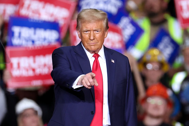 TOPSHOT - Former US President and Republican presidential candidate Donald Trump gestures during a campaign rally at PPG Paints Arena in Pittsburgh, Pennsylvania on November 4, 2024. (Photo by CHARLY TRIBALLEAU / AFP) (Photo by CHARLY TRIBALLEAU/AFP via Getty Images)