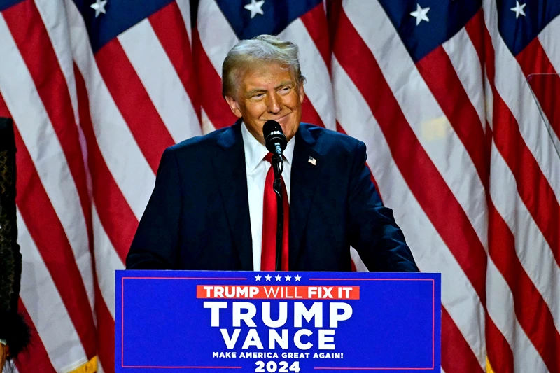 TOPSHOT - Former US President and Republican presidential candidate Donald Trump speaks during an election night event at the West Palm Beach Convention Center in West Palm Beach, Florida, on November 6, 2024. Republican former president Donald Trump closed in on a new term in the White House early November 6, 2024, just needing a handful of electoral votes to defeat Democratic Vice President Kamala Harris. (Photo by Jim WATSON / AFP) (Photo by JIM WATSON/AFP via Getty Images)