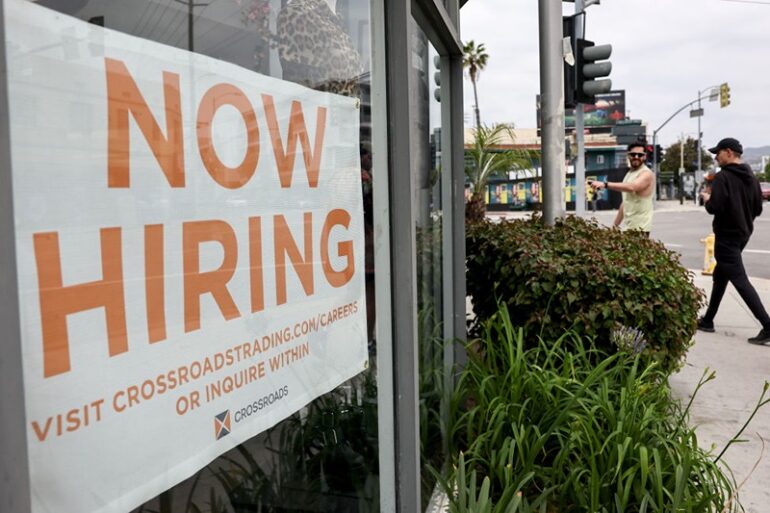 LOS ANGELES, CALIFORNIA - JUNE 02: A 'Now Hiring' sign is displayed outside a resale clothing shop on June 2, 2023 in Los Angeles, California. Today’s U.S. labor report shows that employers added 339,000 jobs in May with sectors including construction, healthcare, business services and transportation adding jobs with wages showing 4.3 percent growth over the same period last year. (Photo by Mario Tama/Getty Images)