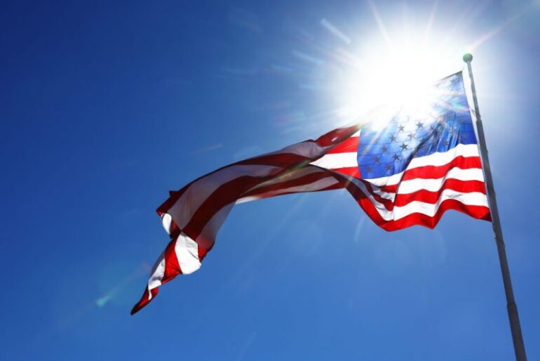 AUSTIN, TEXAS - OCTOBER 20: The flag of the United States flies over the circuit during practice ahead of the F1 Grand Prix of United States at Circuit of The Americas on October 20, 2023 in Austin, Texas. (Photo by Mark Thompson/Getty Images)