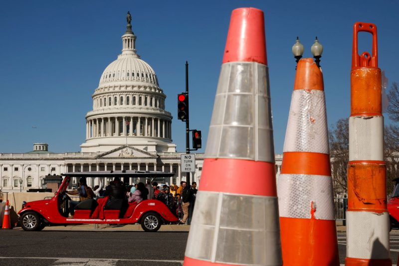 WASHINGTON, DC - MARCH 20: Tourists travel along 1st Street near the East Front of the U.S. Capitol building on March 20, 2023 in Washington, DC. The security posture in Washington appeared normal on Monday after former President Donald Trump called for protests after he announced on social media that he expected to be arrested this week and charged with breaking campaign finance laws for paying an adult film star hush money during the 2016 presidential election. (Photo by Chip Somodevilla/Getty Images)