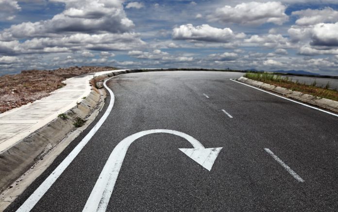 Curved road with a U-turn arrow