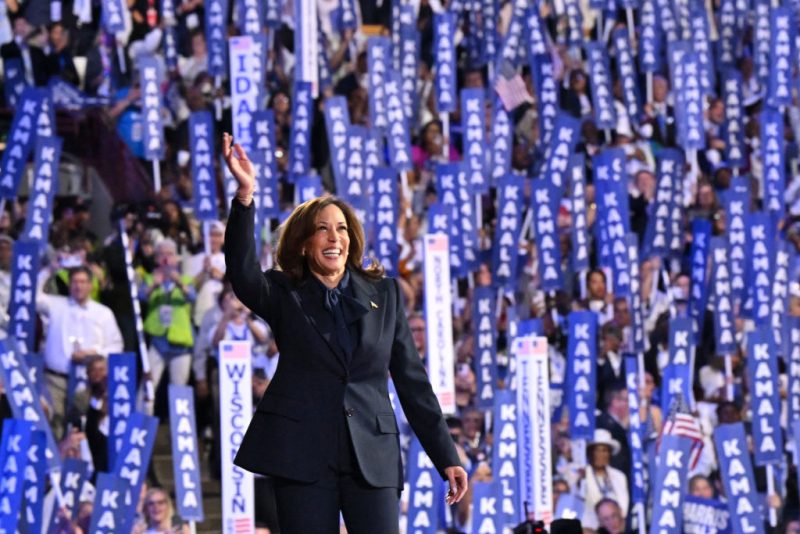 TOPSHOT - US Vice President and 2024 Democratic presidential candidate Kamala Harris waves as she arrives to speak on the fourth and last day of the Democratic National Convention (DNC) at the United Center in Chicago, Illinois, on August 22, 2024. Vice President Kamala Harris formally accepted the party's nomination for president today at the DNC which ran from August 19-22 in Chicago. (Photo by Robyn Beck / AFP) (Photo by ROBYN BECK/AFP via Getty Images)