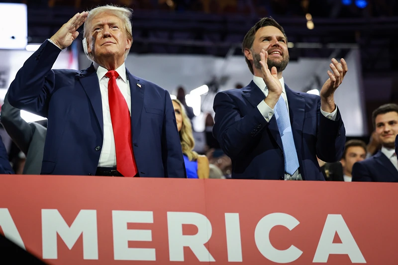 MILWAUKEE, WISCONSIN - JULY 15: Republican presidential candidate, former U.S. President Donald Trump (L) and Republican vice presidential candidate, U.S. Sen. J.D. Vance (R-OH) appear on the first day of the Republican National Convention at the Fiserv Forum on July 15, 2024 in Milwaukee, Wisconsin. Delegates, politicians, and the Republican faithful are in Milwaukee for the annual convention, concluding with former President Donald Trump accepting his party's presidential nomination. The RNC takes place from July 15-18. (Photo by Joe Raedle/Getty Images)