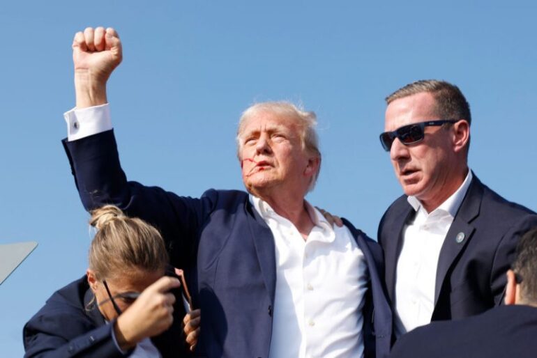 BUTLER, PENNSYLVANIA - JULY 13: Republican presidential candidate former President Donald Trump is rushed offstage during a rally on July 13, 2024 in Butler, Pennsylvania. Butler County district attorney Richard Goldinger said the shooter is dead after injuring former U.S. President Donald Trump, killing one audience member and injuring another in the shooting. (Photo by Anna Moneymaker/Getty Images)